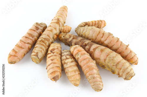 fresh turmeric roots isolated on white background