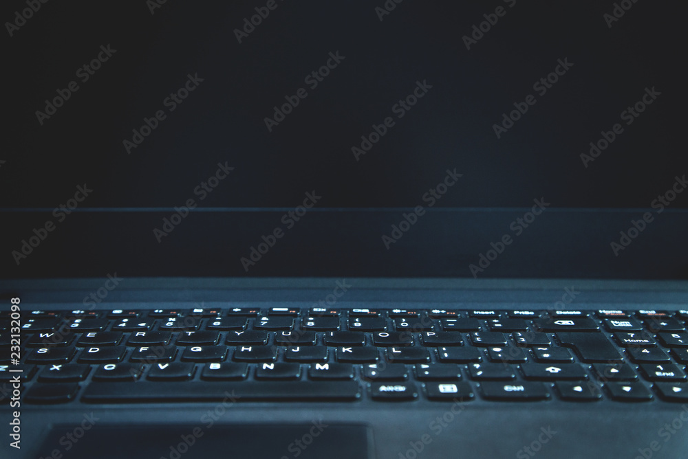 Black laptop keyboard background. Technology concept Black laptop keyboard background. Technology concept
