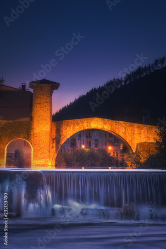 Balmaseda bridge at night with Cadagua river and waterfall photo