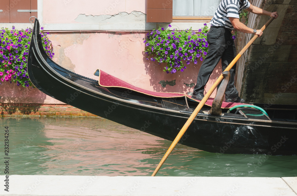 Venice canal, channel and gondolier