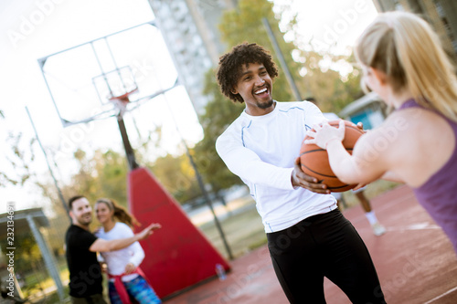 Multiracial couple playing ...