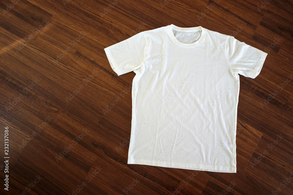 White t-shirt on wood background White t-shirt on wood background