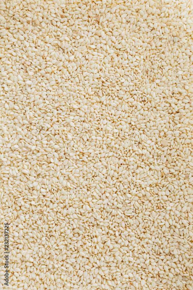 White sesame seeds background. Useful seeds for cooking White sesame seeds background. Useful seeds for cooking
