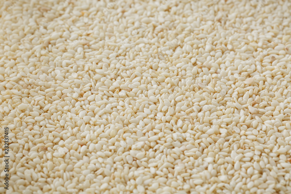 White sesame seeds background. Useful seeds for cooking White sesame seeds background. Useful seeds for cooking