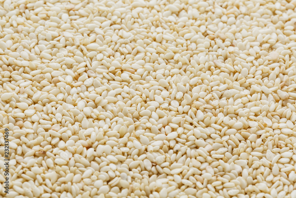 White sesame seeds background. Useful seeds for cooking White sesame seeds background. Useful seeds for cooking