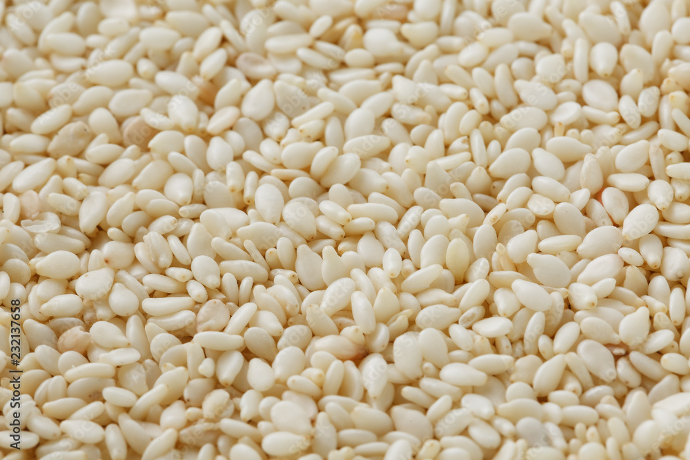 White sesame seeds background. Useful seeds for cooking White sesame seeds background. Useful seeds for cooking