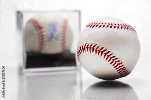 Baseball With Display Case Autographed Memorabilia Blurred In Background Isolated On White