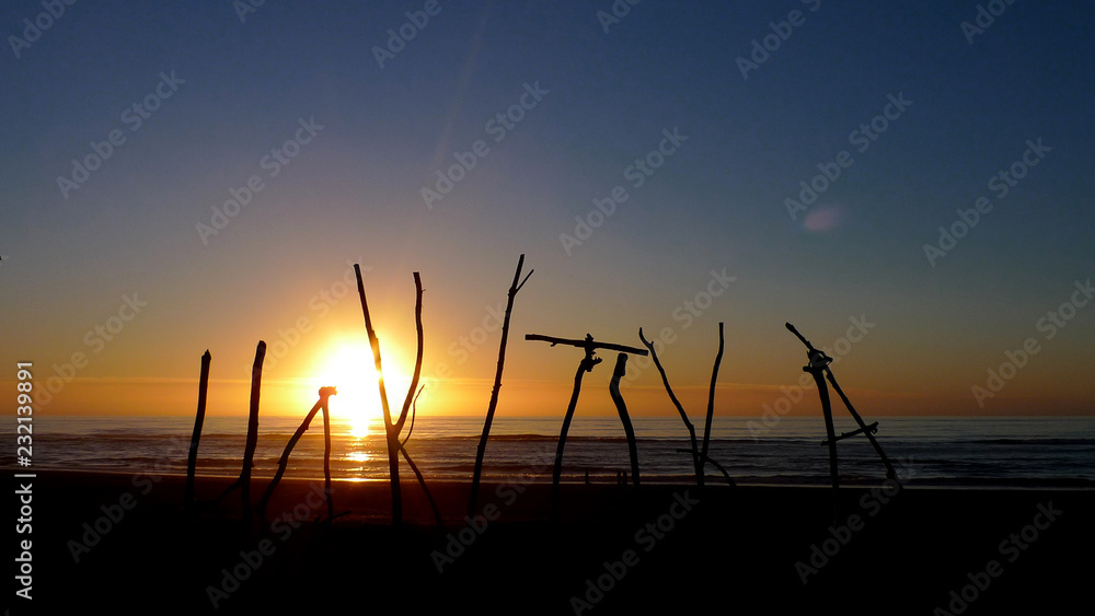 Sunset with Hokitika Sign in New Zealand Sunset with Hokitika Sign in New Zealand