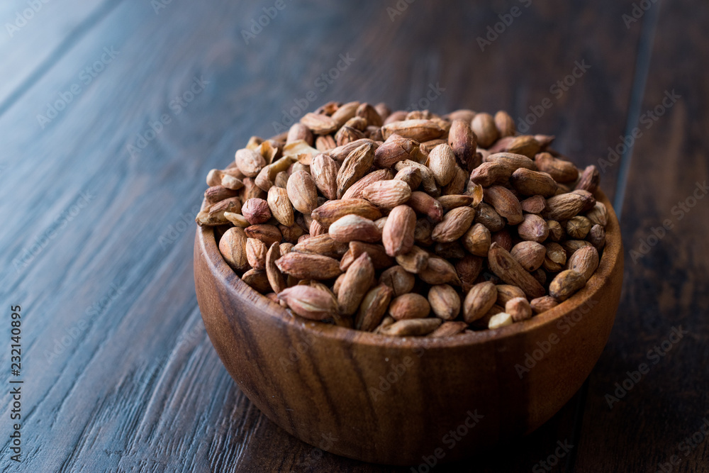 Organic Pistachio Nuts Without Shell in Wooden Bowl. Organic Pistachio Nuts Without Shell in Wooden Bowl.