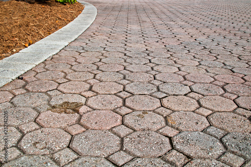 low angle stained brick paver driveway