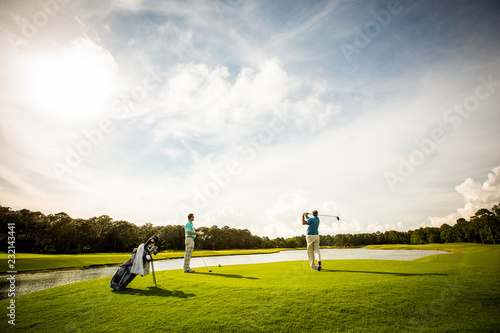 Men Teeing off for a Game of Golf