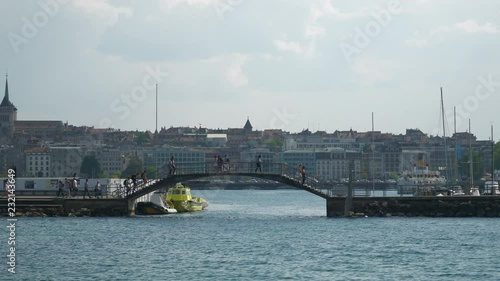 evening time geneva city lakeside pedestrian bridge slow motion panorama 4k switzerland
