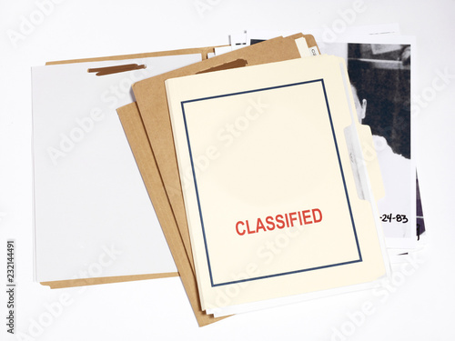 Several confidential file folders with pictures