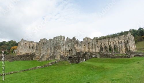 The ruins of the church Abbey. A shell of a building, stone walls and window arches largely intact but no roof photo