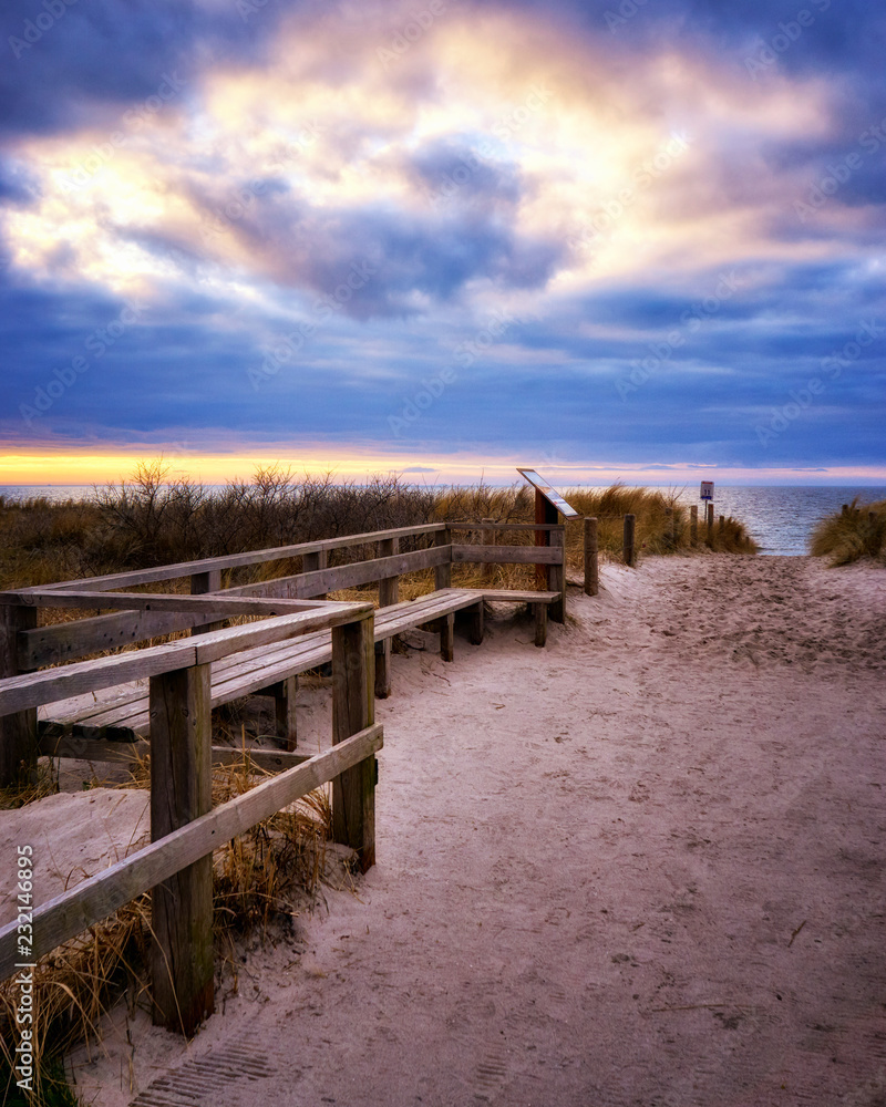 Obraz premium Sand away to the beach in Ahrenshoop in Mecklenburg-Western Pomerania on the peninsula Fischland-Darss-Zingst on the Baltic Sea.