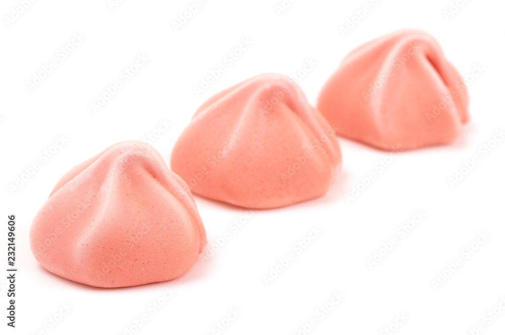 Line of Three Pink Meringues on a White Background Line of Three Pink Meringues on a White Background