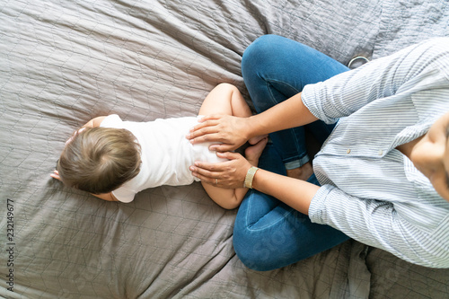 Mother and baby in bedroom