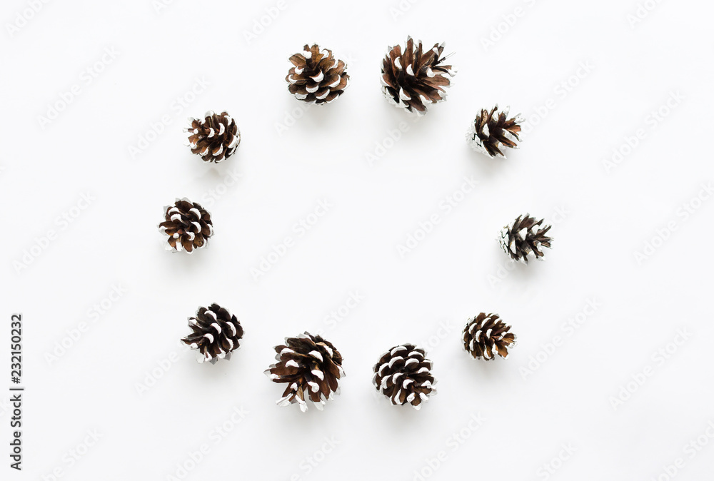 Christmas composition. Pine cones on white background. Christmas composition. Pine cones on white background.