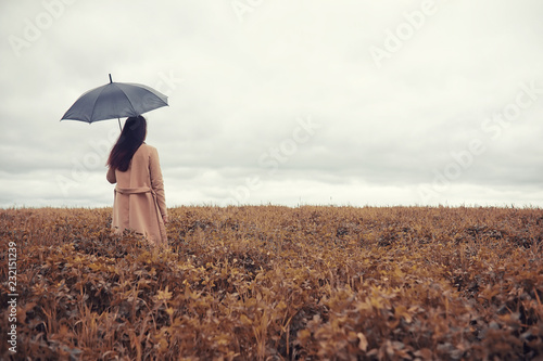 Young girl in autumn park