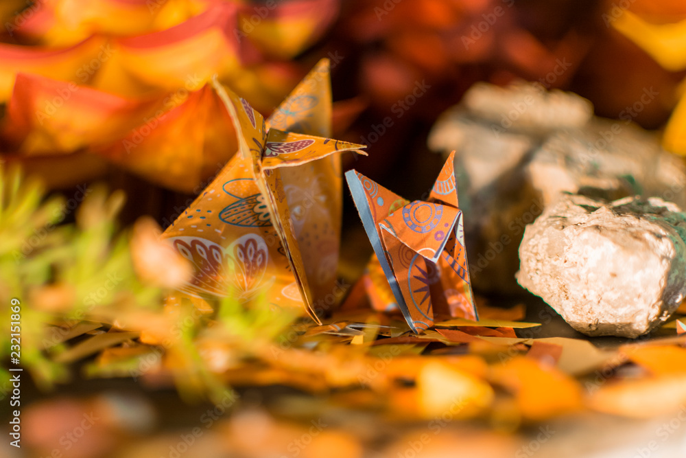 A fox with her puppy in an fall origami forest A fox with her puppy in an fall origami forest