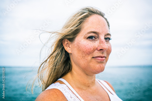Portrait of blonde woman with freckles