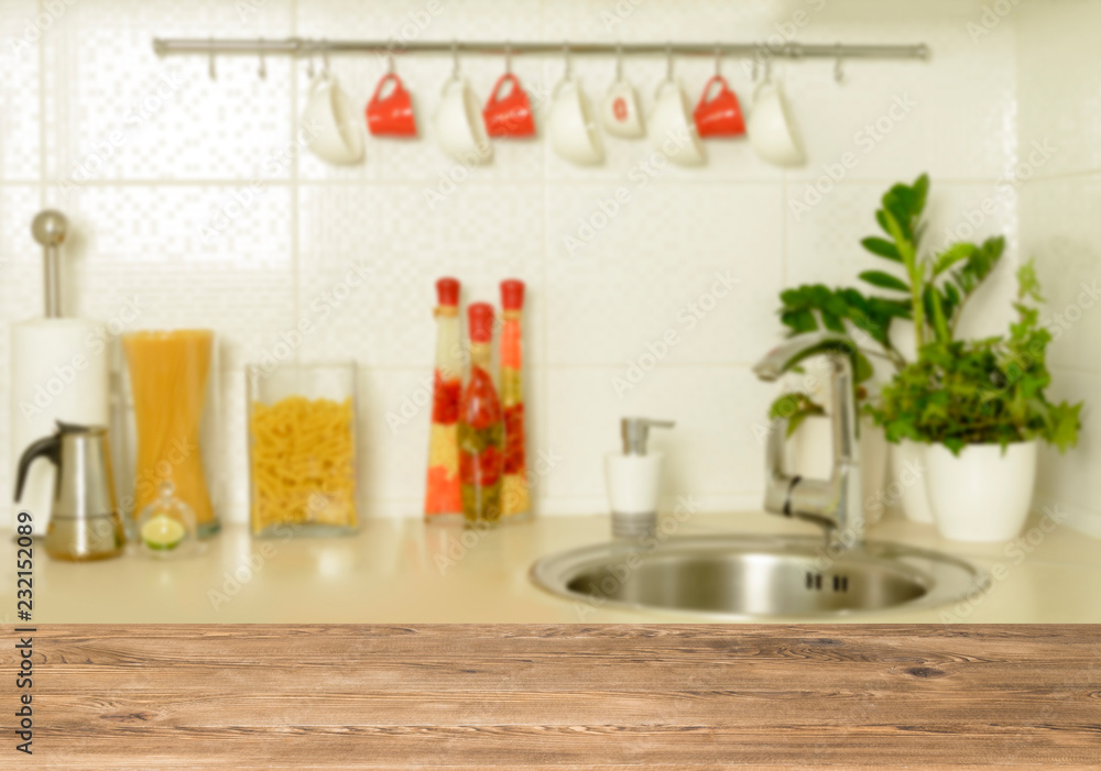 Wooden table top on blur interior background Wooden table top on blur interior background