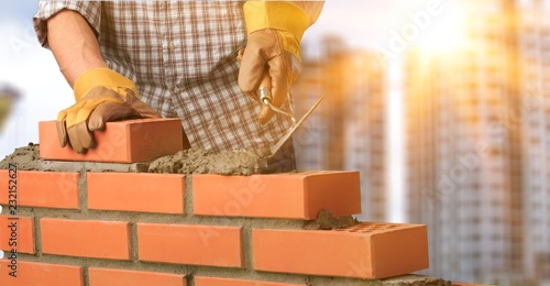 Obraz na płótnie Bricklayer constructor architecture background block brick