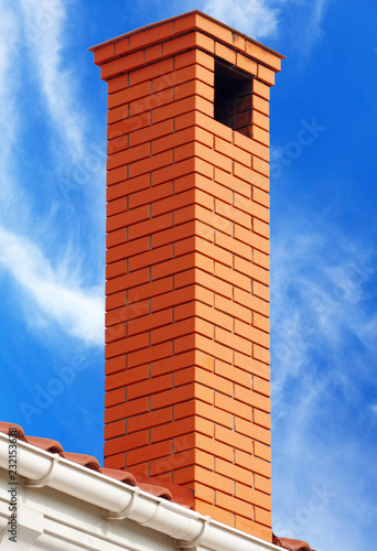 brick smokestack isolated on background of sky