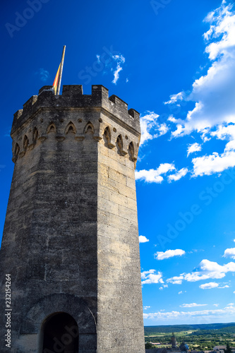 Tower of the Duchal Palace in the medieval village of Uzes in the Gard region of Provence, France photo