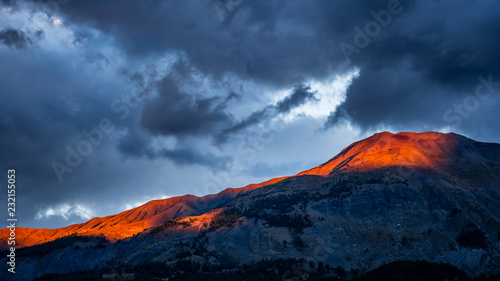 Maritime Alps in South of France illuminated by dramatic sunset light and skies