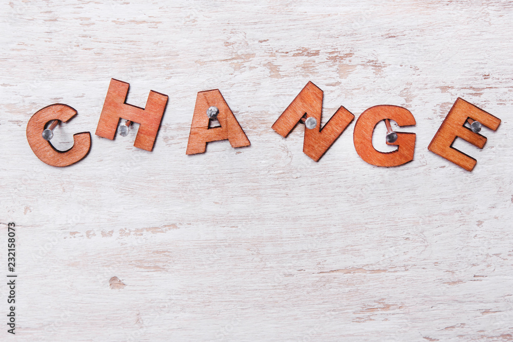 Fototapeta premium word change of wooden letters