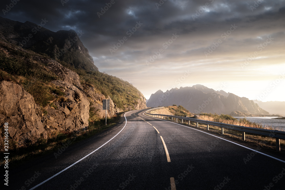 Naklejka premium road by the sea in sunrise time, Lofoten island, Norway