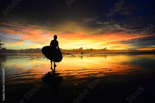 silhouette of stand up paddle board player in the sunset (actual short)