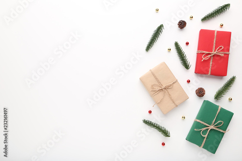 Christmas gift boxes with fir tree branches on white background © 5second