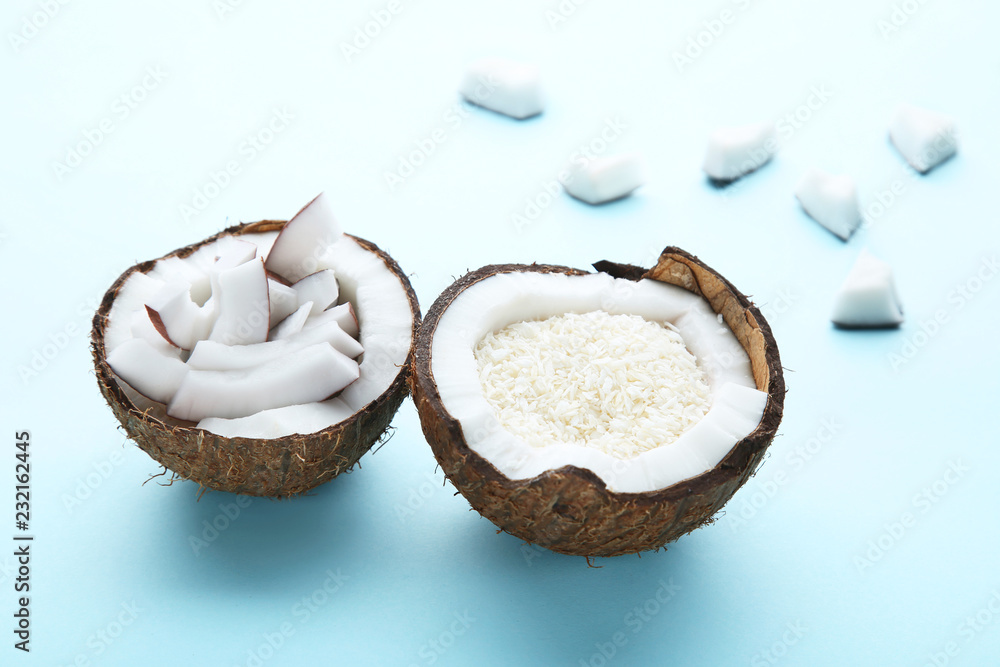 Piece of coconut with flakes on blue background Piece of coconut with flakes on blue background