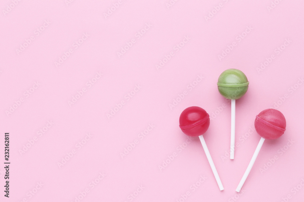 Sweet lollipops on pink background Sweet lollipops on pink background