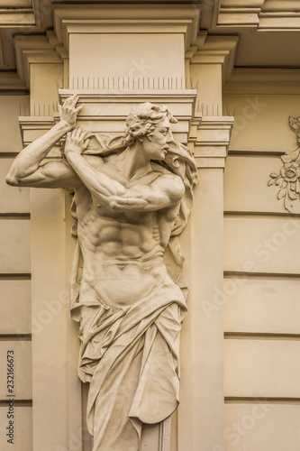 A telamon (male figure used on a column), Vienna, Austria photo