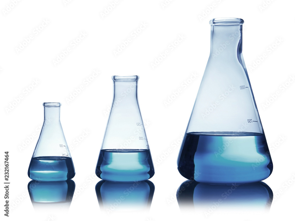 Conical flasks with liquid on table against color background. Laboratory analysis Conical flasks with liquid on table against color background. Laboratory analysis