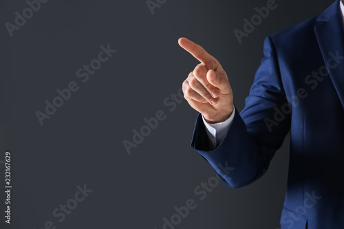 Man with toilet paper in pocket suffering from diarrhea on color background