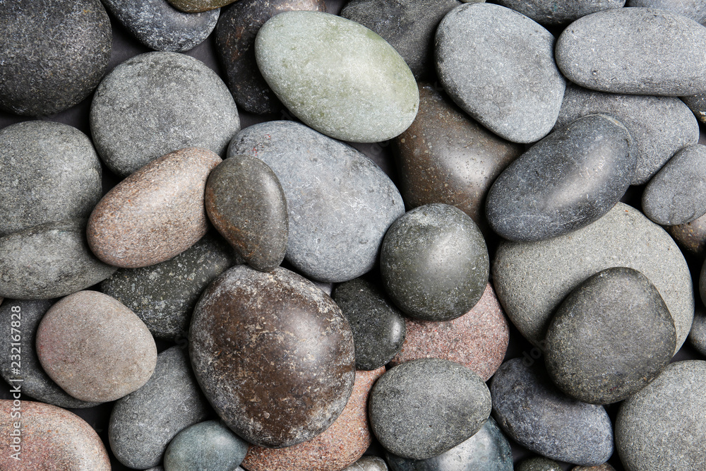 Composition with spa stones as background, top view Composition with spa stones as background, top view