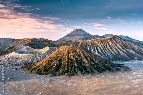 View of Mountains Bromo against cloudy sky photo