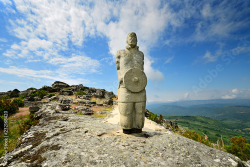 A galician-lusitanian warrior watch the horizon on the top of the Iron Age settlement of Outeiro Lesenho at 1073m. Boticas, Tras os Montes. Portugal photo
