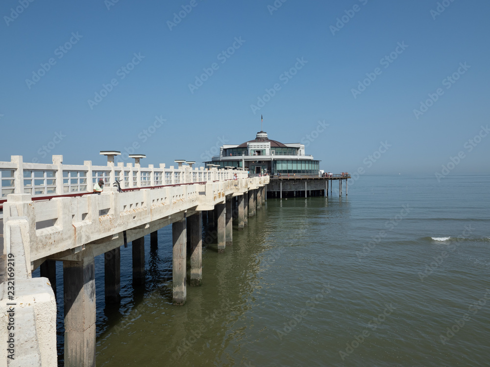 Wide angle image of the pier near the beach of Blankenberge.