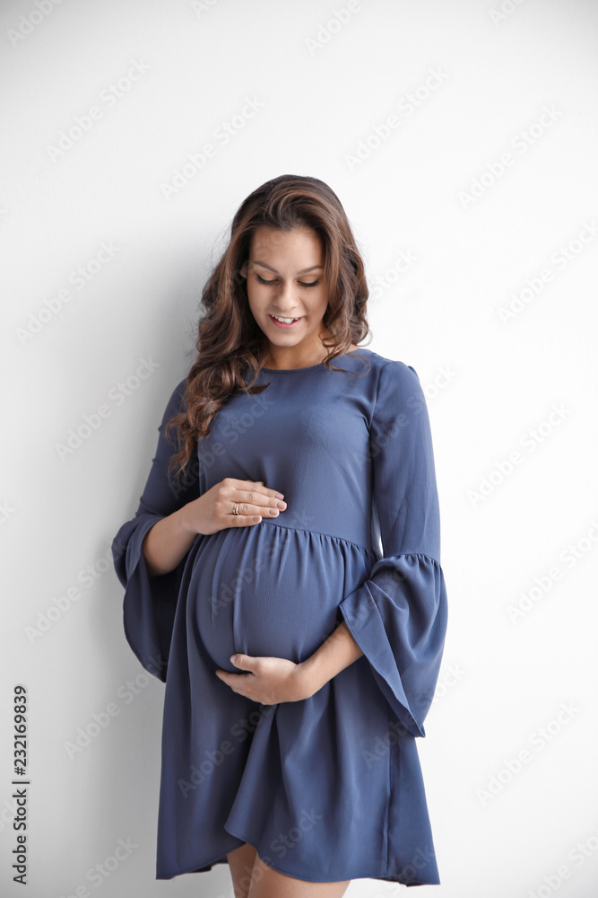 Happy young pregnant woman on white background Happy young pregnant woman on white background