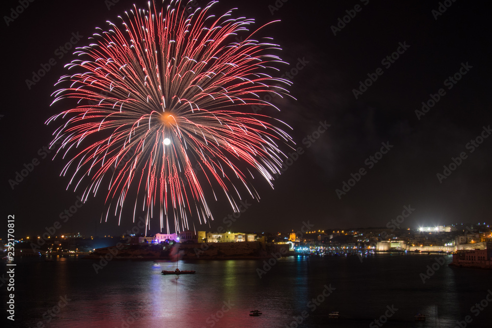 Orange , purple, red and gold fireworks during a firework festival in Malta, 2018 Orange , purple, red and gold fireworks during a firework festival in Malta, 2018