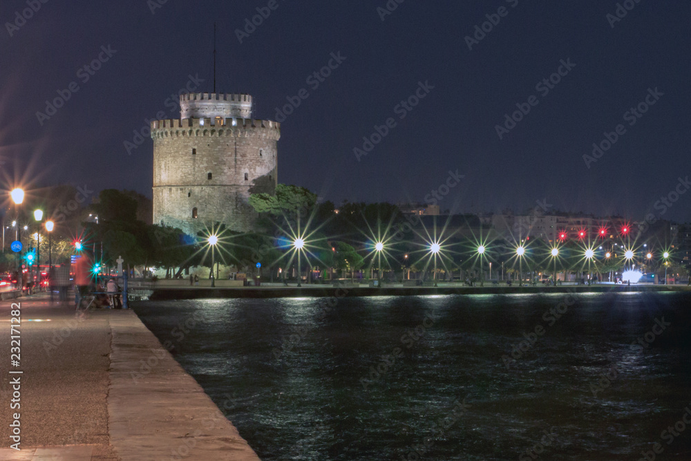 The white tower of Thessaloniki and the port with reflections on the water
