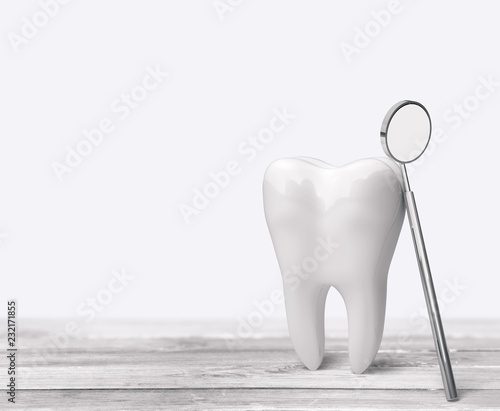 Big tooth and dentist mirror in dentist clinic on background