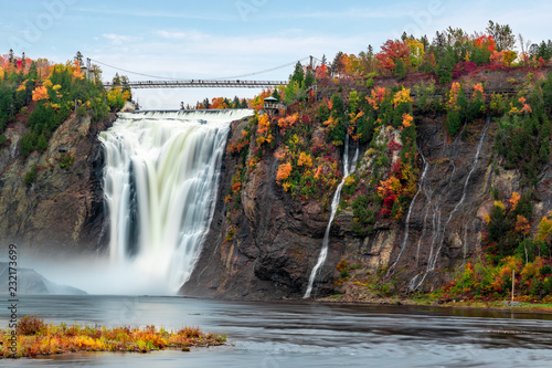 Montmorency Falls and Bridge in autumn with colorful trees photo