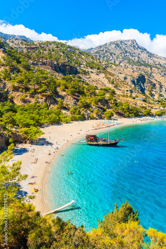 Tableau sur toile Sailing boat anchoring at beautiful Apella beach on Karpathos island, Greece