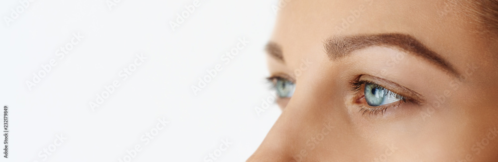 Fototapeta premium Femal face with blue eyes without make-up